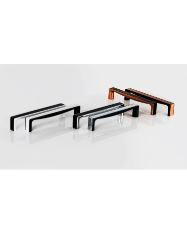 Tirador de mueble TWIX tirador de diseño colocado sobre una superficie blanca