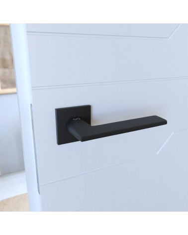 Manija de puerta de zamak ARA diseño montada en una puerta