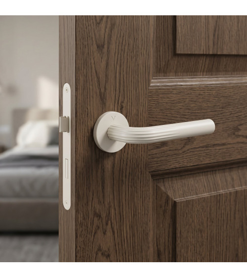 Manija de puerta minimalista en zamak FRELLA redonda diseño