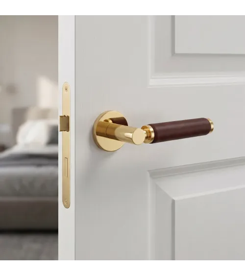 Manija de puerta dorada pulida en cuero oscuro TUPAI 4200/201 redonda - diseño de tirador