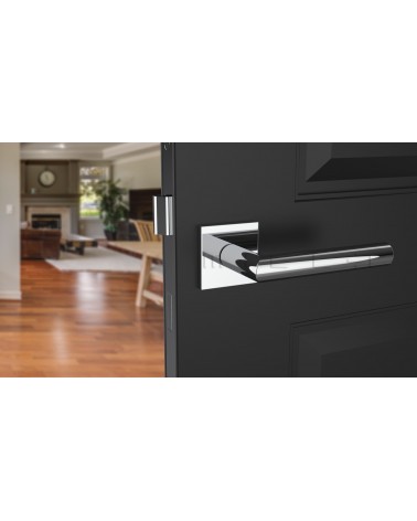 Tirador de puerta cromada pulida ARABIS tirador de diseño vista inclinada montada en una puerta
