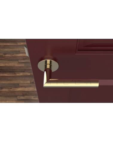 Tirador de puerta color oro pulido ARABIS tirador de diseño vista desde arriba montado en una puerta