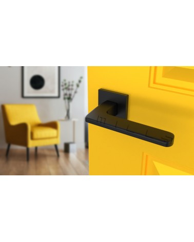 Tirador de puerta moderno YUKA tirador de diseño vista desde arriba inclinado montado en una puerta