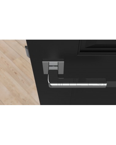 Manija SALICE ferretería de diseño en cromo pulido vista superior montada en una puerta