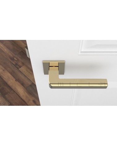 Tirador de puerta dorado pulido SALICE herrajes de diseño vista superior montada en una puerta