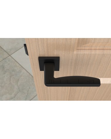 Manija de puerta negra ERBA manija de diseño vista desde arriba montada en una puerta