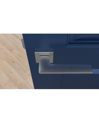 Tirador de puerta cromo satinado LUNARIA tirador de diseño vista desde arriba montado en una puerta