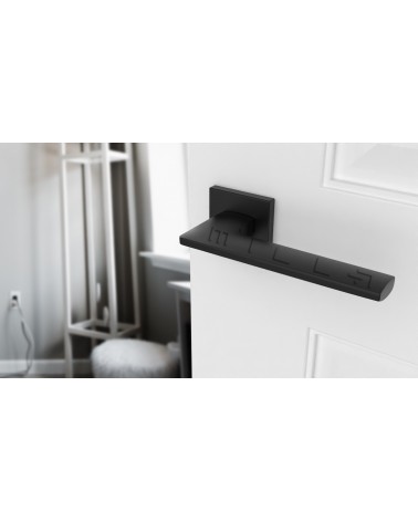 Manilla de puerta moderna LUNARIA manilla de diseño vista superior inclinada montada en una puerta