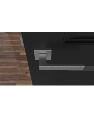 Manilla de puerta cromo satinado SULLA manilla de diseño vista superior montada en una puerta