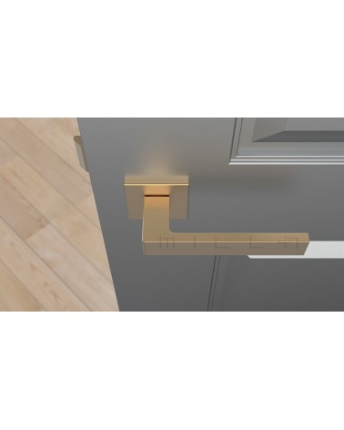 Manilla dorado mate SULLA manilla de diseño vista superior montada en una puerta