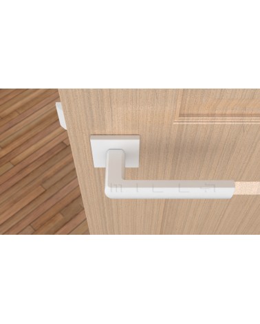 Tirador de puerta blanca HOSTA ferretería design vista desde arriba montada en una puerta