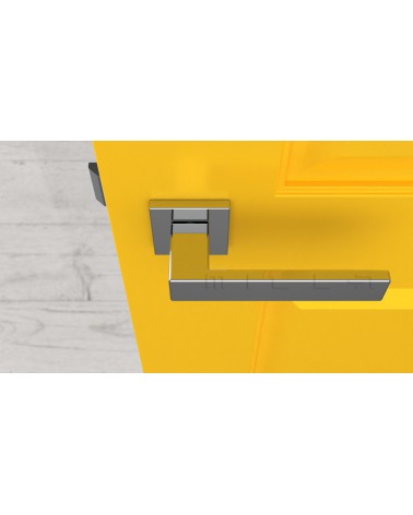 Manilla de puerta cromo pulido PINA manilla de diseño vista superior montada en una puerta
