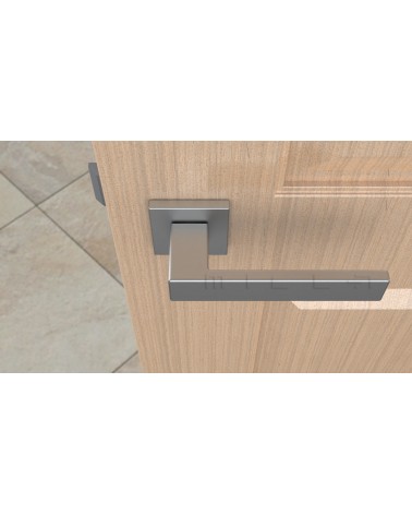 Manija de puerta cromo satinado PINA manija de diseño vista superior montada en una puerta