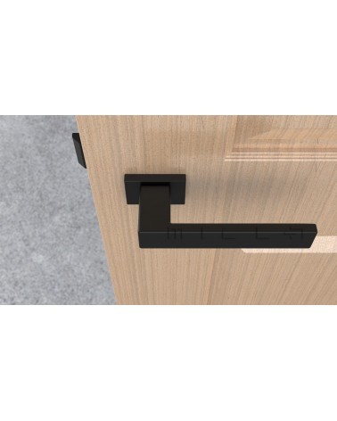 Tirador de puerta negra PINA tirador de diseño vista superior montada en una puerta