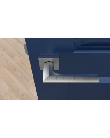 Tirador de puerta cromo satinado JASMINA tirador de diseño vista desde arriba montada en una puerta