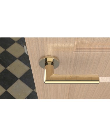 Palanca de puerta oro pulido KALMIA palanca de diseño vista superior montada en una puerta