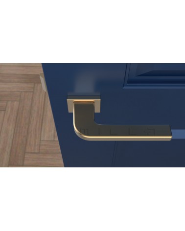 Manija de puerta oro mate ISMENA ferretería diseño vista desde arriba montada en una puerta