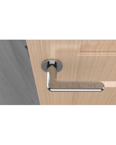 Tirador de puerta cromo pulido LIRA tirador de diseño vista superior montado en una puerta