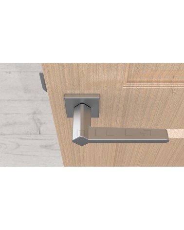 Manilla de puerta color cromo satinado NINFEA manilla de diseño vista desde arriba montada en una puerta