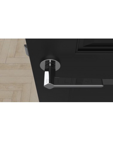Manilla de puerta estilo futurista NINFEA herraje de diseño vista desde arriba montada en una puerta