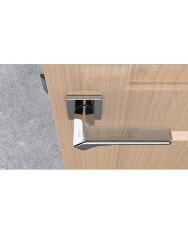 Tirador de puerta cromada pulida BERGERIA herraje de diseño vista superior montada en una puerta