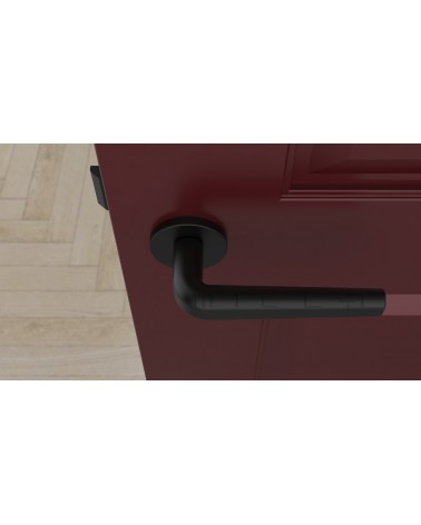 Tirador de puerta negra INULLA tirador de diseño vista superior montada en una puerta