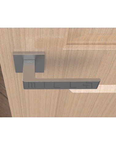 Maneta de puerta cromo cepillado Apollo diseño vista superior montada en una puerta