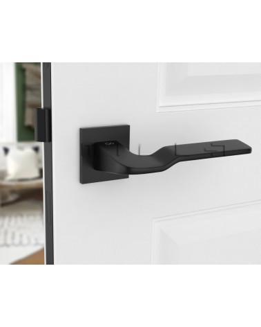 Palanca de puerta futurista LINE BALI herraje de diseño montada en una puerta entreabierta