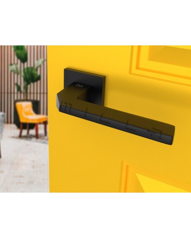 Palanca de puerta sobria ETNA herraje de diseño vista inclinada montada en una puerta