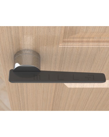 Tirador de puerta bicolor JUMELLE diseño vista desde arriba montada en una puerta