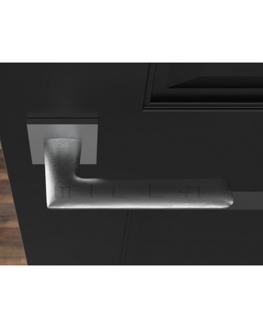Manilla de puerta cromo pulido Line GIULIA manilla de diseño vista superior montada en una puerta