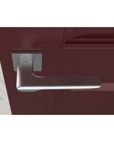 Maneta de puerta cromo cepillado LIGNE diseño vista superior montada en una puerta