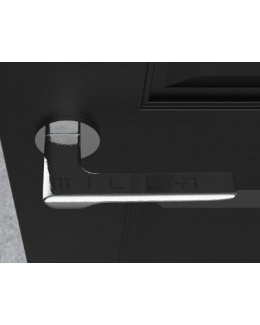 Palanca de puerta cromo pulido LIGNE manilla de diseño vista desde arriba montada en una puerta
