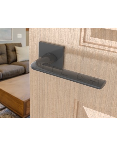 Manija de puerta titanio STINGER diseño vista inclinada montada en una puerta
