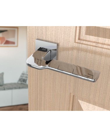 Manija de puerta cromo pulido LINE BALI herraje design vista inclinada montada en una puerta