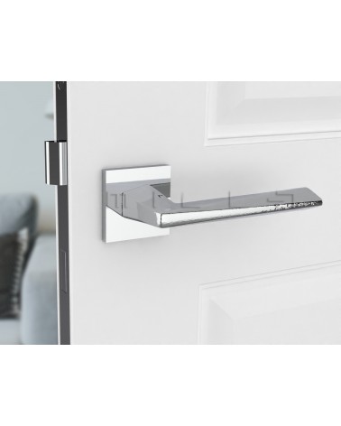 Manija de puerta moderna DIAMANT diseño vista de frente montada en una puerta