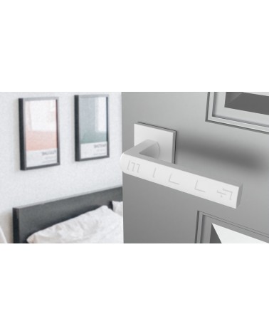 Manecilla de puerta en zamak HOSTA diseño vista superior inclinada montada en una puerta