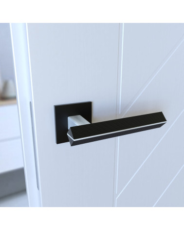 Palanca de puerta en zamak CARRERA palanca de diseño color 1 montada en una puerta vista inclinada