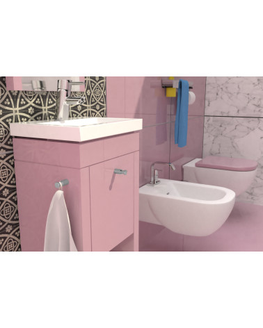 Botón de mueble CARTAGENA tirador de diseño fijado en un mueble rosa en un cuarto de baño