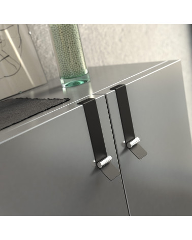 Tirador de mueble negro mate/cromo brillante TORN diseño montado en un mueble