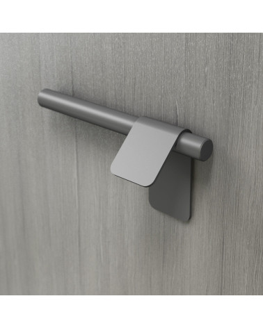 Tirador de mueble antracita TORN-3 tirador de diseño fijado en una superficie gris