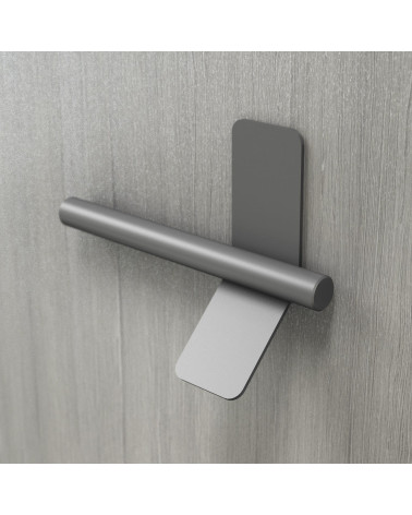 Tirador de mueble antracita TORN-4 diseño fijado en una superficie gris