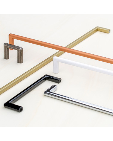 Tirador de mueble NOX diseño posado sobre una superficie blanca