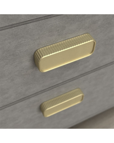 Tirador de mueble oro mate WEGA tirador de diseño visto desde arriba fijado en un cajón