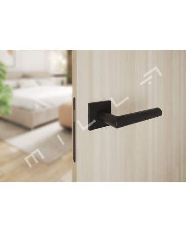 Tirador de puerta negra ARABIS tirador de diseño montado en una puerta