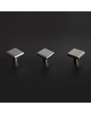 Botón de mueble titanio NOX tirador de diseño dispuesto sobre un fondo oscuro