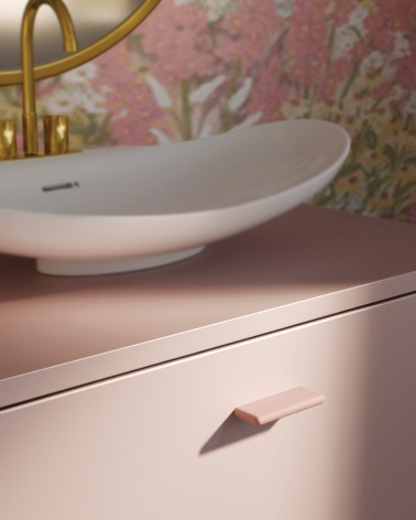 Tirador de mueble rosa polvos NOX-1 diseño decorativo montado en un mueble de baño