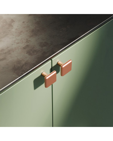 Tirador de mueble cobre NOX diseño decorativo fijado en un mueble