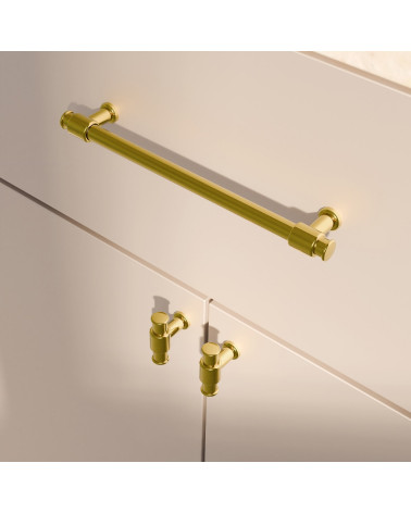 Tirador de mueble oro pulido GALIUM diseño montado verticalmente en un mueble
